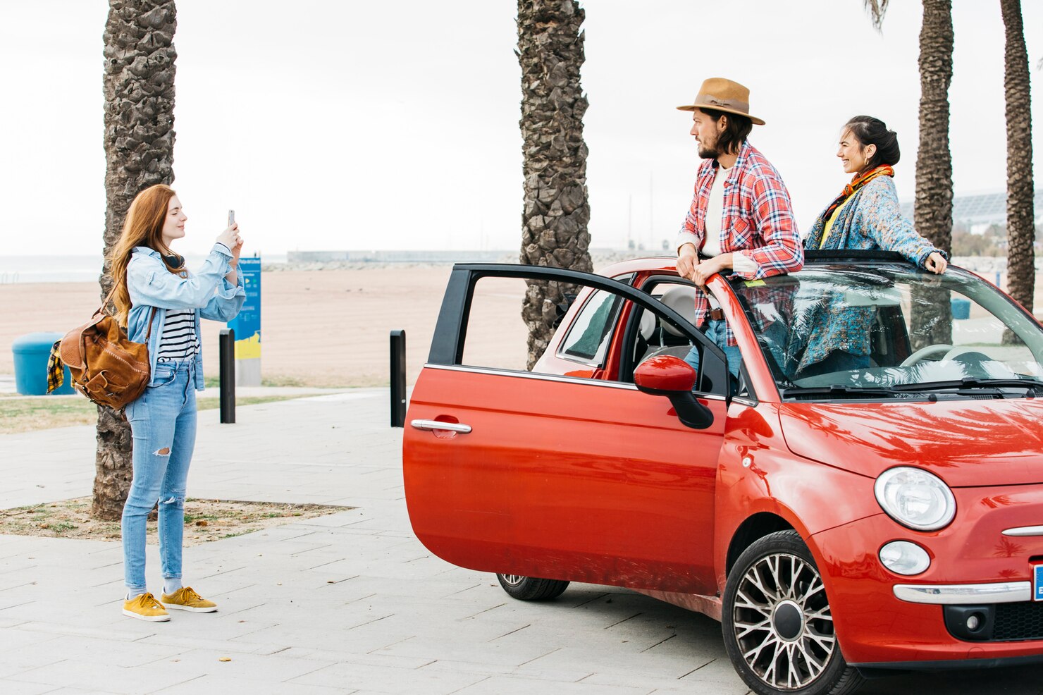 woman-taking-picture-couple-car_23-2148039029